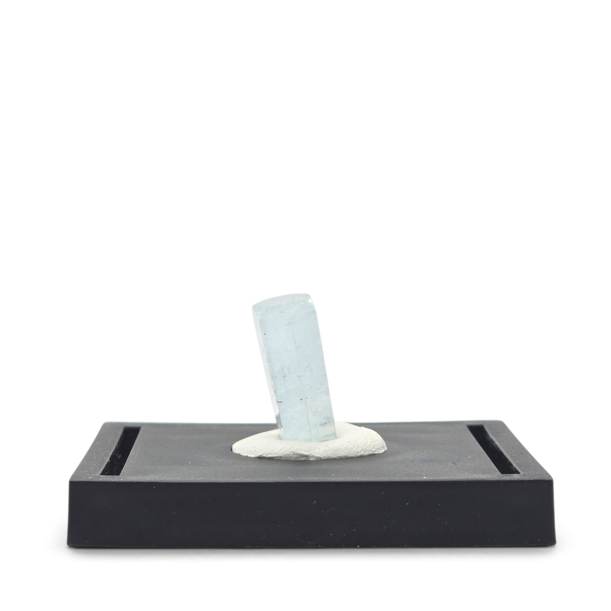 Side view of the slender translucent aquamarine crystal mounted at a slight angle