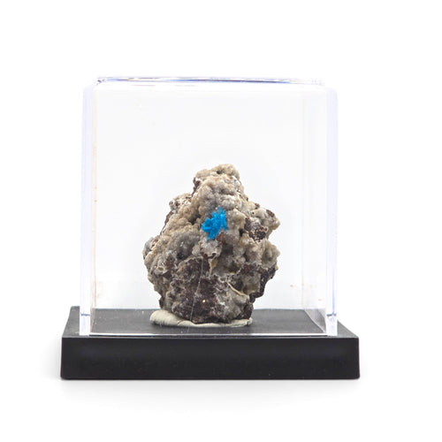 Cavansite specimen mounted on a black base beneath a clear display cover