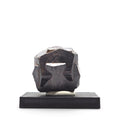 Front view of a dark metallic iron-cross pyrite twin mounted on a black display base