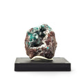 Front view of green dioptase crystals lining cavities in reddish-brown matrix on a black display base